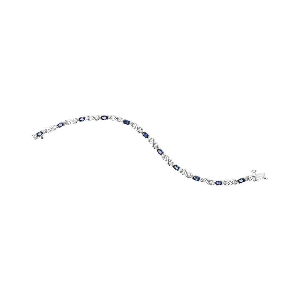 10k White Gold 5x4mm Oval Sapphire Gemstone and 1/10 Cttw Diamond Prong Set ?X’ Link Bracelet - Size 7’’ (h-i