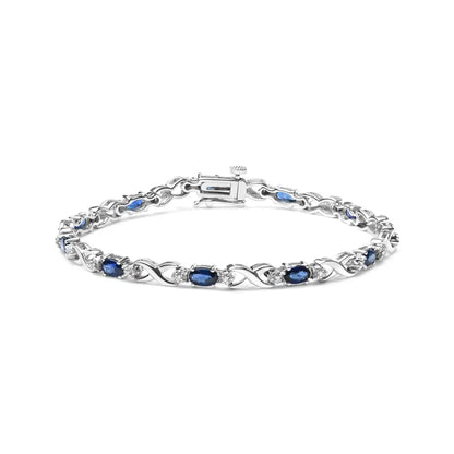 10k White Gold 5x4mm Oval Sapphire Gemstone and 1/10 Cttw Diamond Prong Set ?X’ Link Bracelet - Size 7’’ (h-i