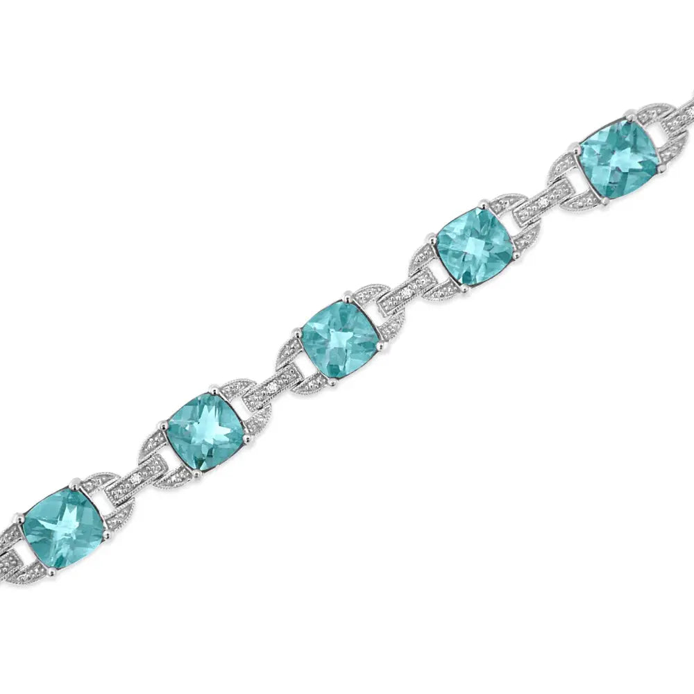 .925 Sterling Silver 7x7 Mm Cushion Cut Blue Topaz and 1/20 Cttw Round Diamond Fashion Tennis Bracelet (i-j Color I1-i2