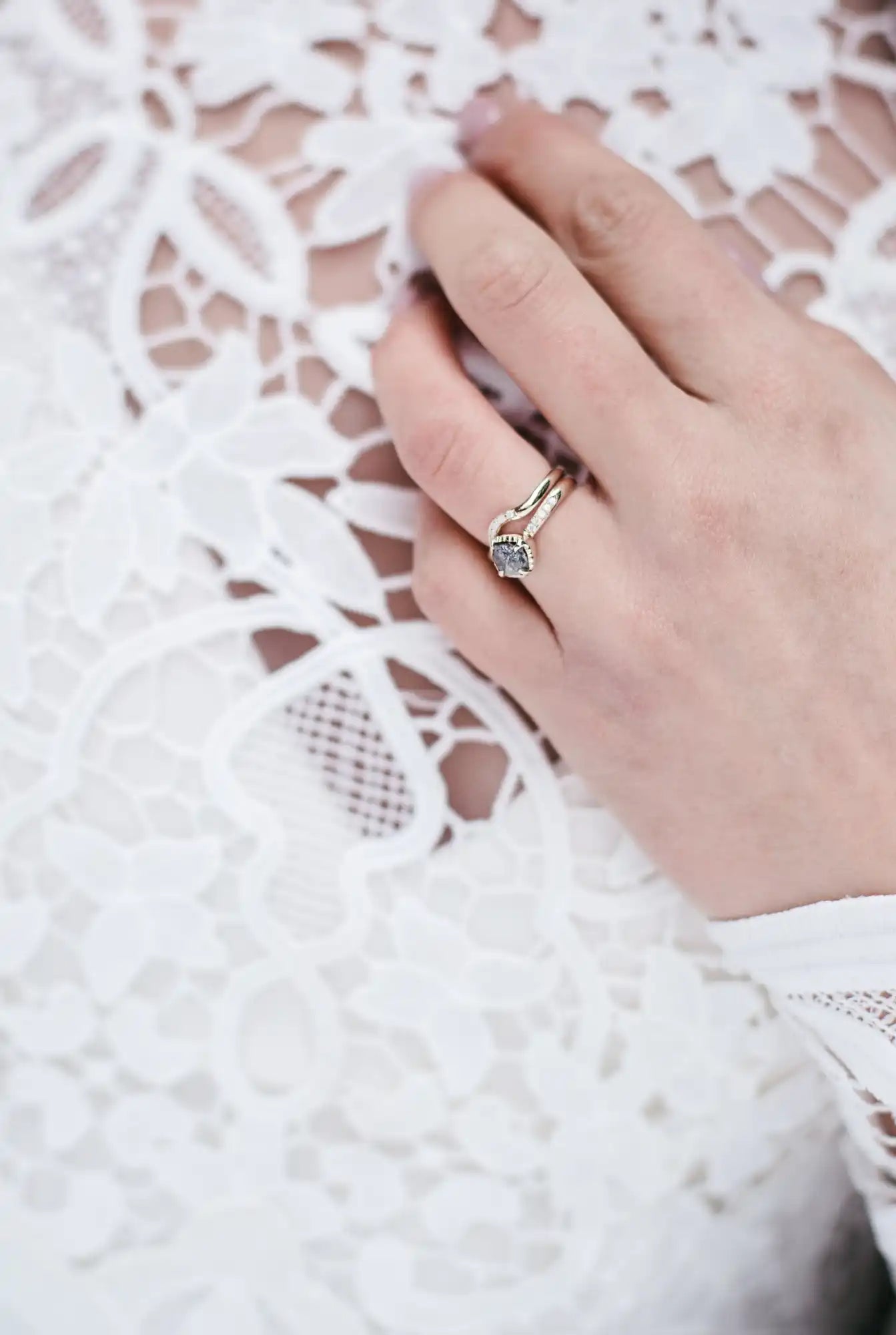 Diamond engagement ring on a person's hand