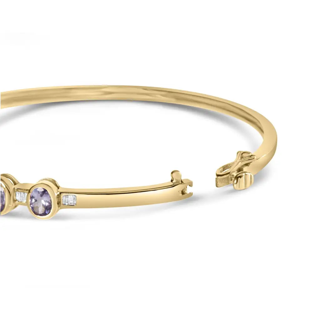 Elegant 14k Gold Alternating Bezel Diamond Bangle with Tanzanite