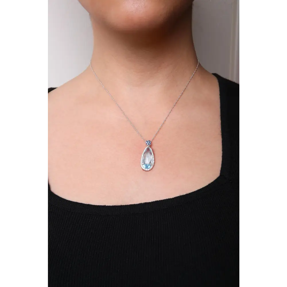 Elegant 18k White Gold Floral Teardrop Pendant with Sky Blue Topaz