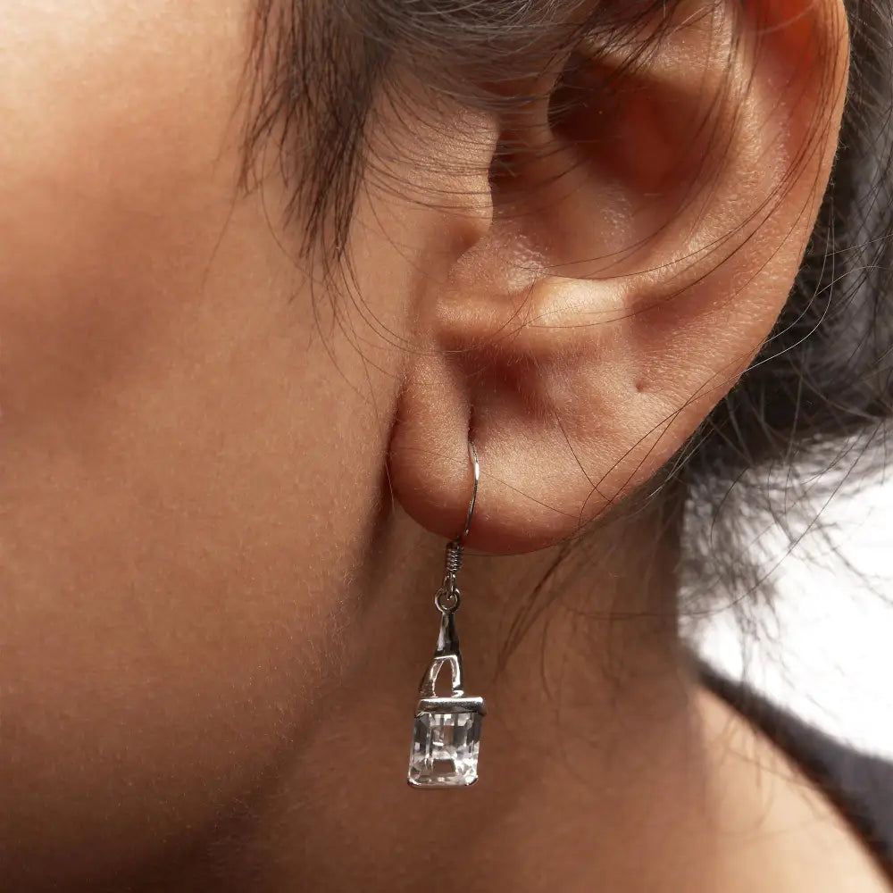 Elegant Emerald Cut White Topaz Solitaire Dangle Earrings in Sterling Silver