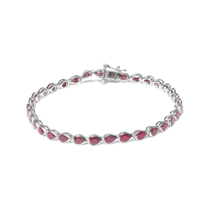 Elegant Sterling Silver Bezel Bracelet with Lab Created Pink Ruby Pear Shape