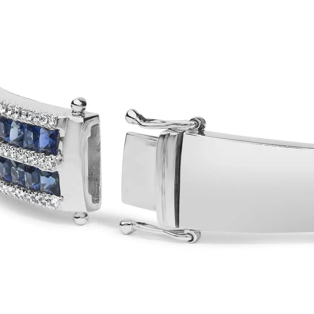 Exquisite 18k White Gold Alternating Diamond and Princess Cut Blue Bangle