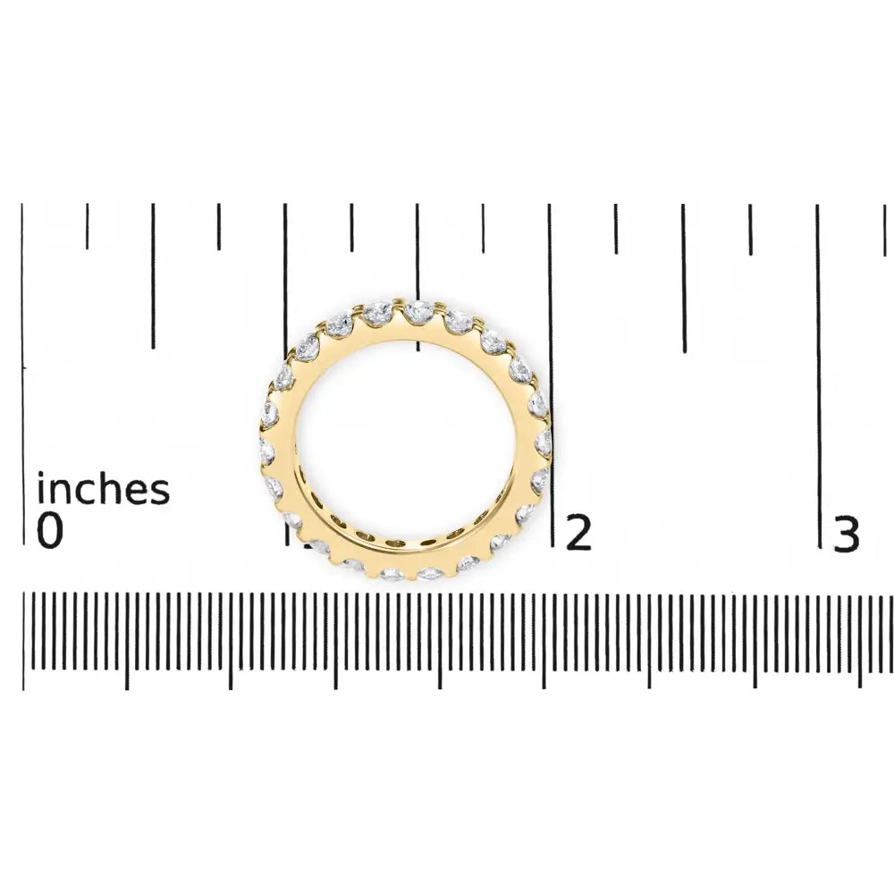 Exquisite Yellow Gold Shared Prong Eternity Band with Round Diamonds