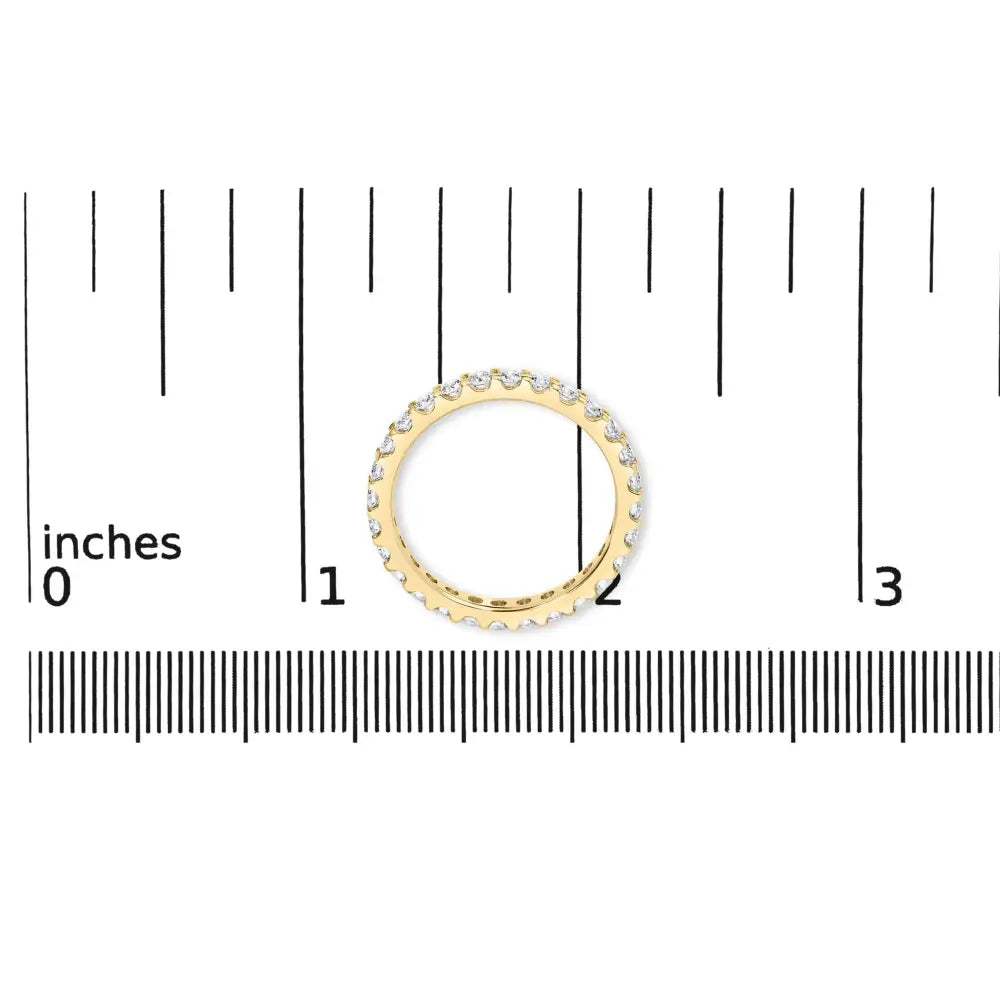 Exquisite Yellow Gold Shared Prong Eternity Band with Round Diamonds