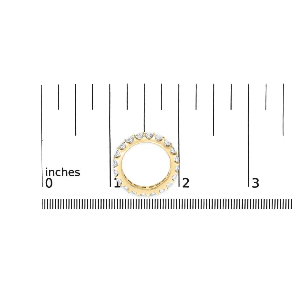 Exquisite Yellow Gold Shared Prong Eternity Band with Round Diamonds