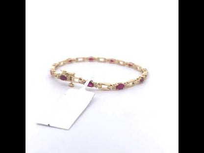 10K Yellow Gold Oval Ruby and 1/10 Cttw Diamond Bar Prong Set Bracelet